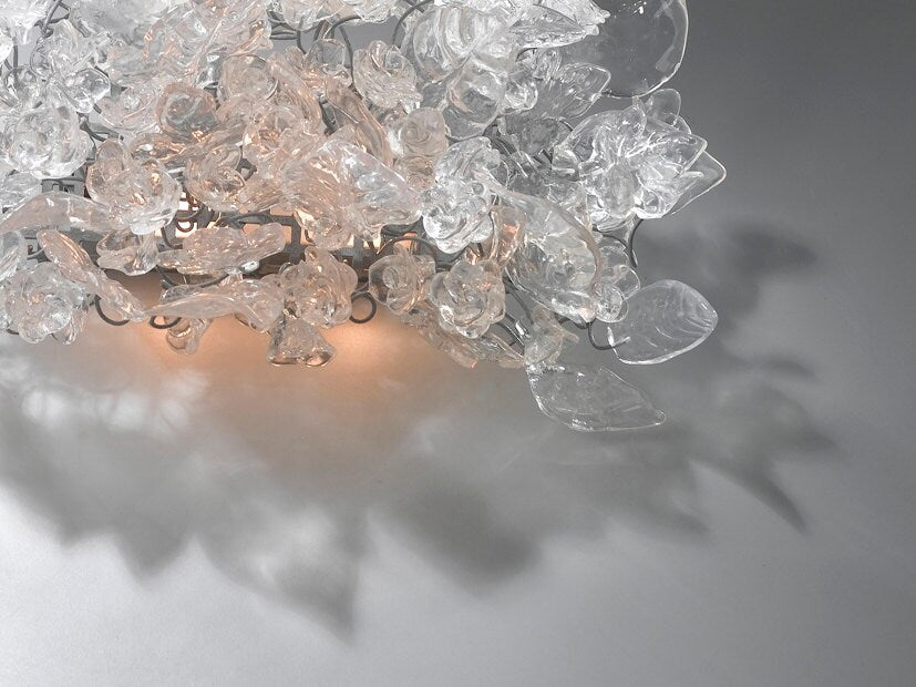 Bronze Sconce With Whimsical Resin Leaves In clear color.