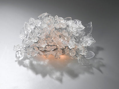 Bronze Sconce With Whimsical Resin Leaves In clear color.