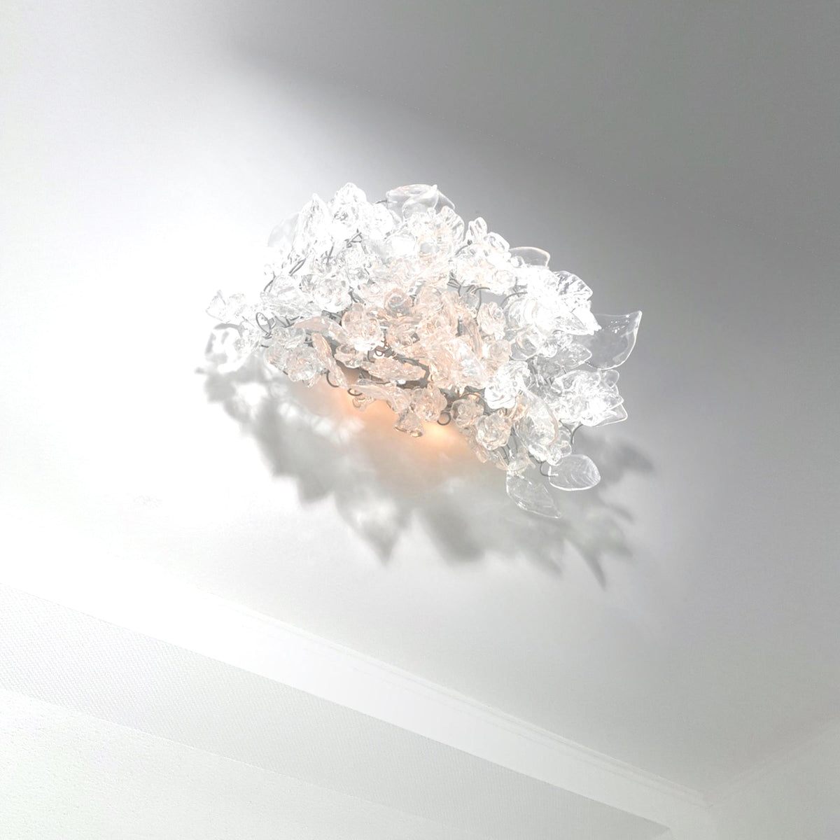 Bronze Sconce With Whimsical Resin Leaves In clear color.